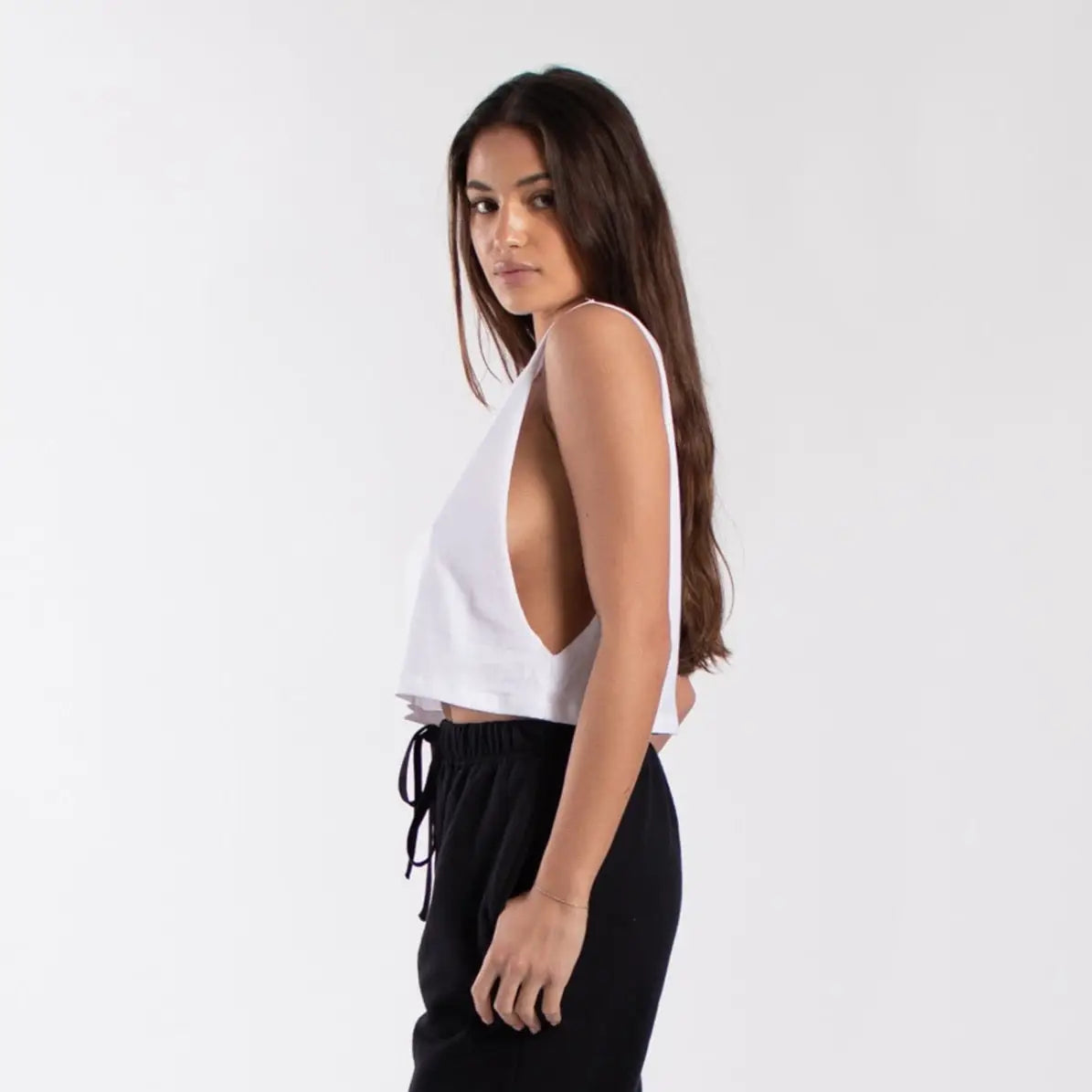 Garment dyed white cropped muscle tank with side cutouts and drawstring waistband