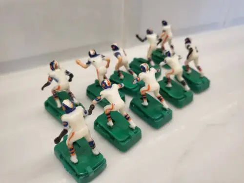 Vintage Denver Broncos electronic football figures in white uniforms with stands