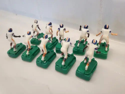 Vintage Denver Broncos electronic football figures in white uniforms with stands