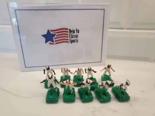 Miniature Denver Broncos electronic football figures in white uniforms with stands