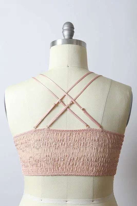 Light pink smocked bandeau top with criss-cross spaghetti straps, crochet daisy longline bralette