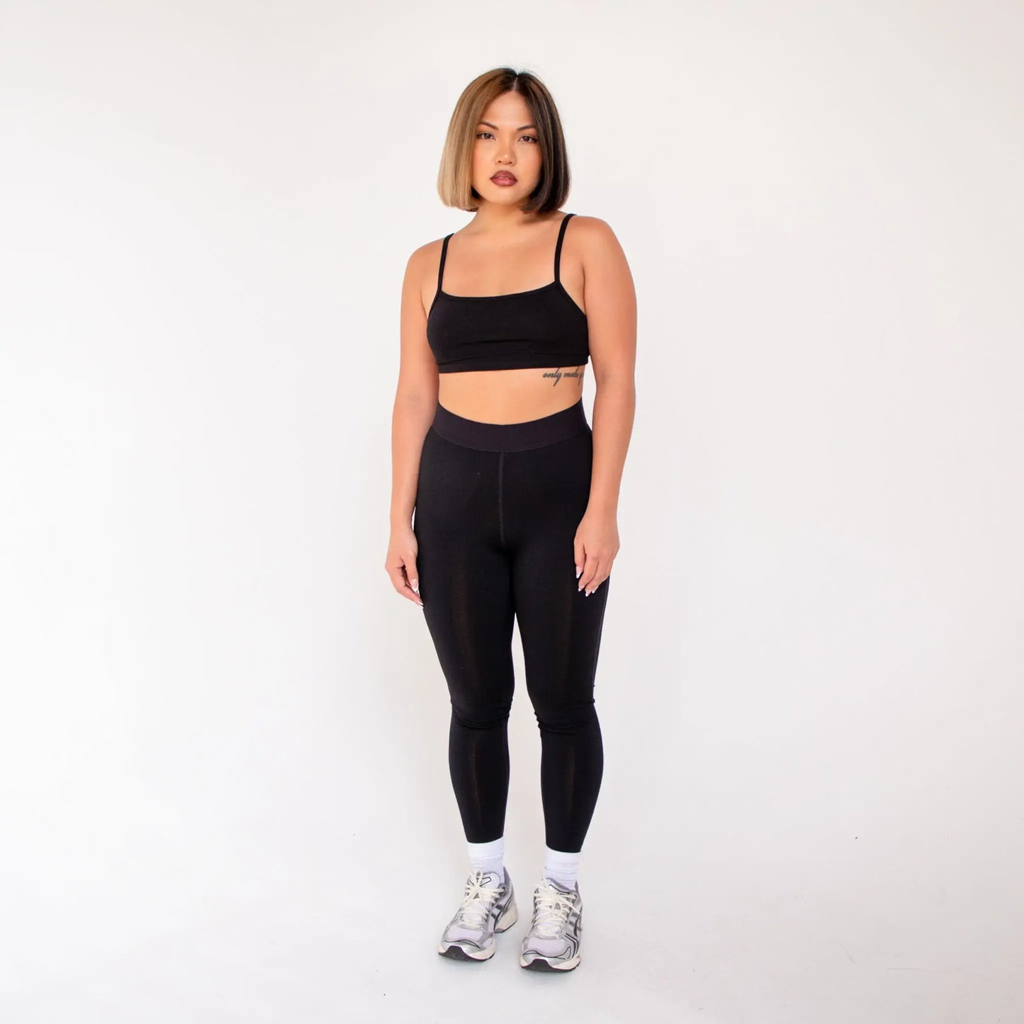 Black high-waist leggings with thin straps made of spandex or nylon, info otlapparel