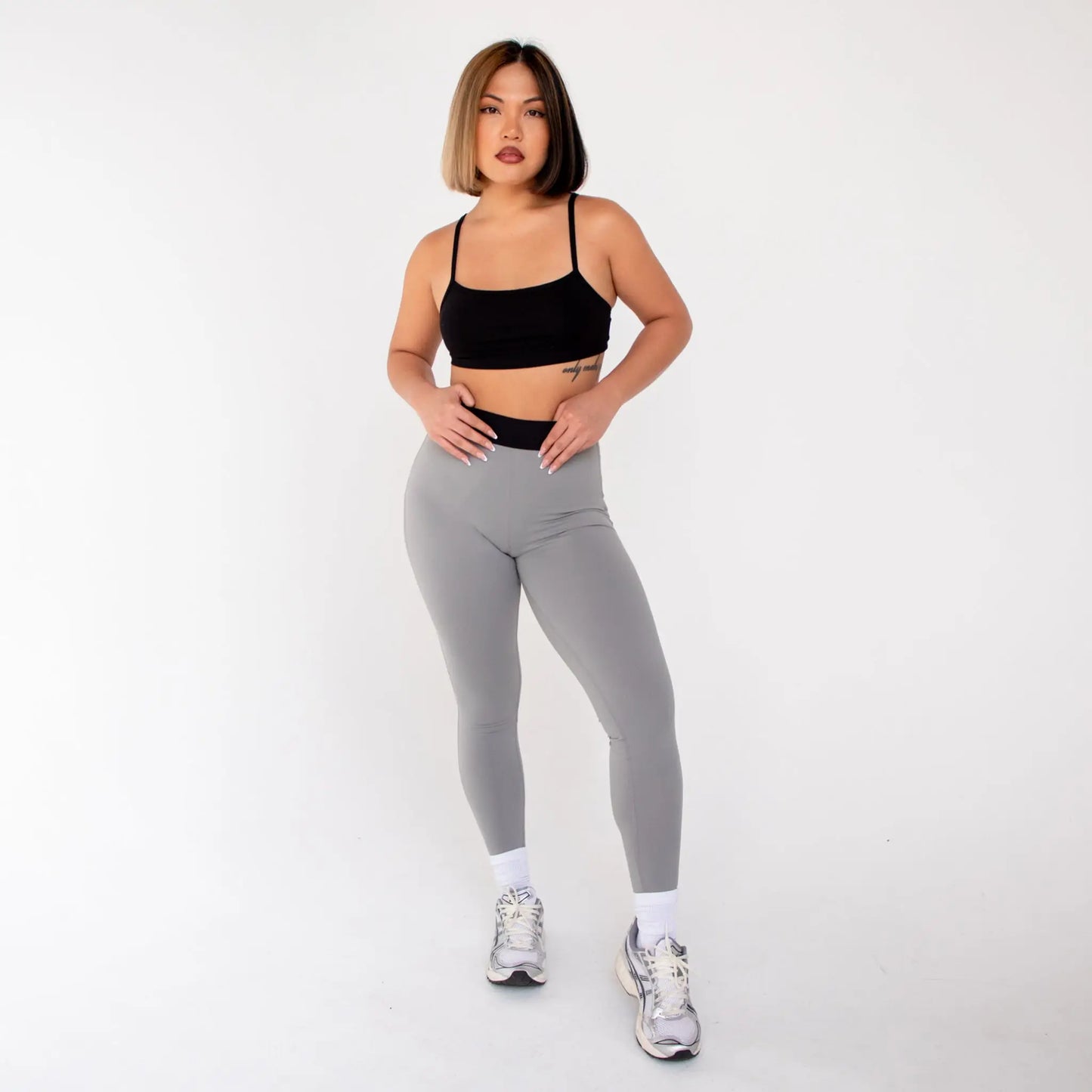 Grey leggings with black waistband and white sneakers from 1000BD Womens Banded Pro Legging info otlapparel
