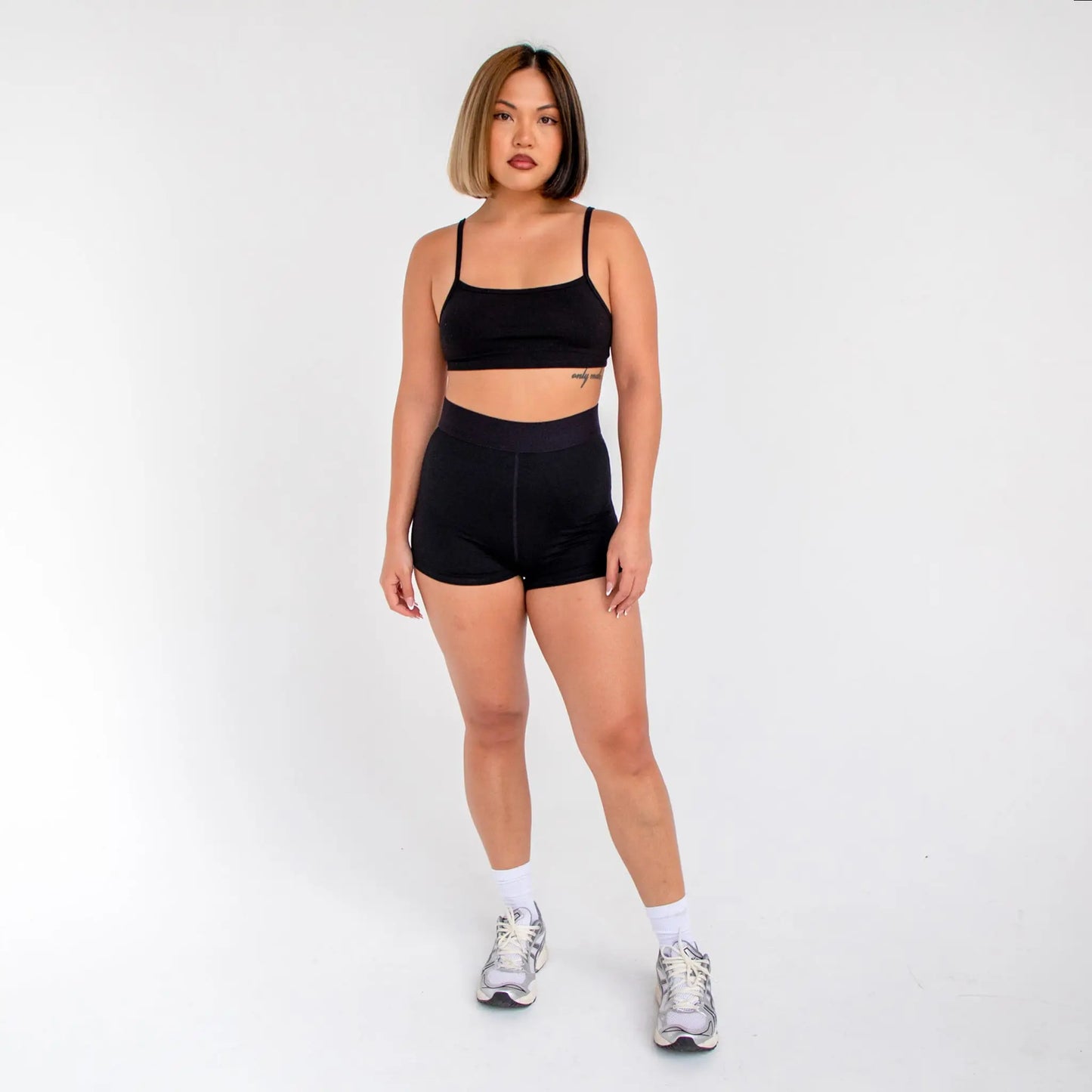Black high-waisted athletic shorts with white logo from 1001BD Women’s Banded Pro Shorts, info otlapparel