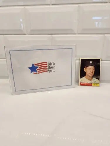 Baseball trading card of Whitey Ford in protective case for 1961 Topps #160