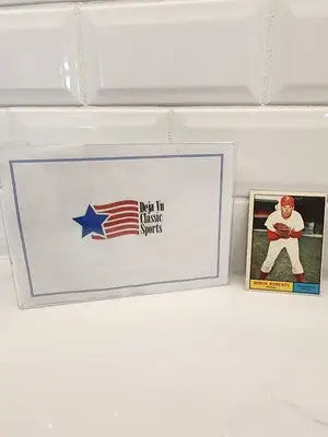 Baseball card and box featuring 1961 Topps Robin Roberts #20 EX-NM