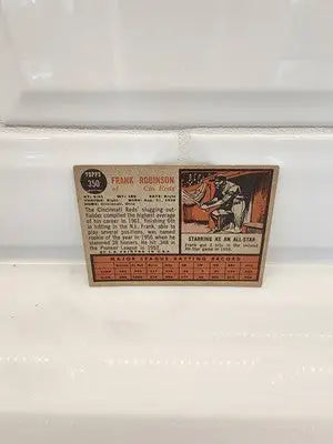 Vintage Frank Robinson baseball card from 1962 Topps featuring Frank Robinson in EX-NM condition