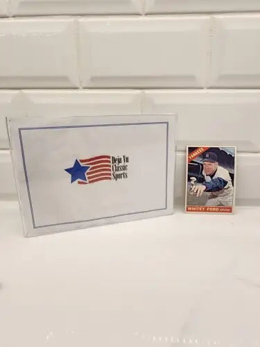 Trading card and sealed pack featuring 1966 Topps Whitey Ford #160 EX memory
