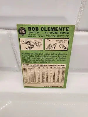 Vintage baseball card featuring 1967 Topps Roberto Clemente #400 in EX condition