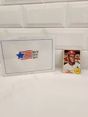 Baseball card featuring Bob Gibson and Deja Vu Classic Sports card, 1968 Topps Bob Gibson #100 VG-EX