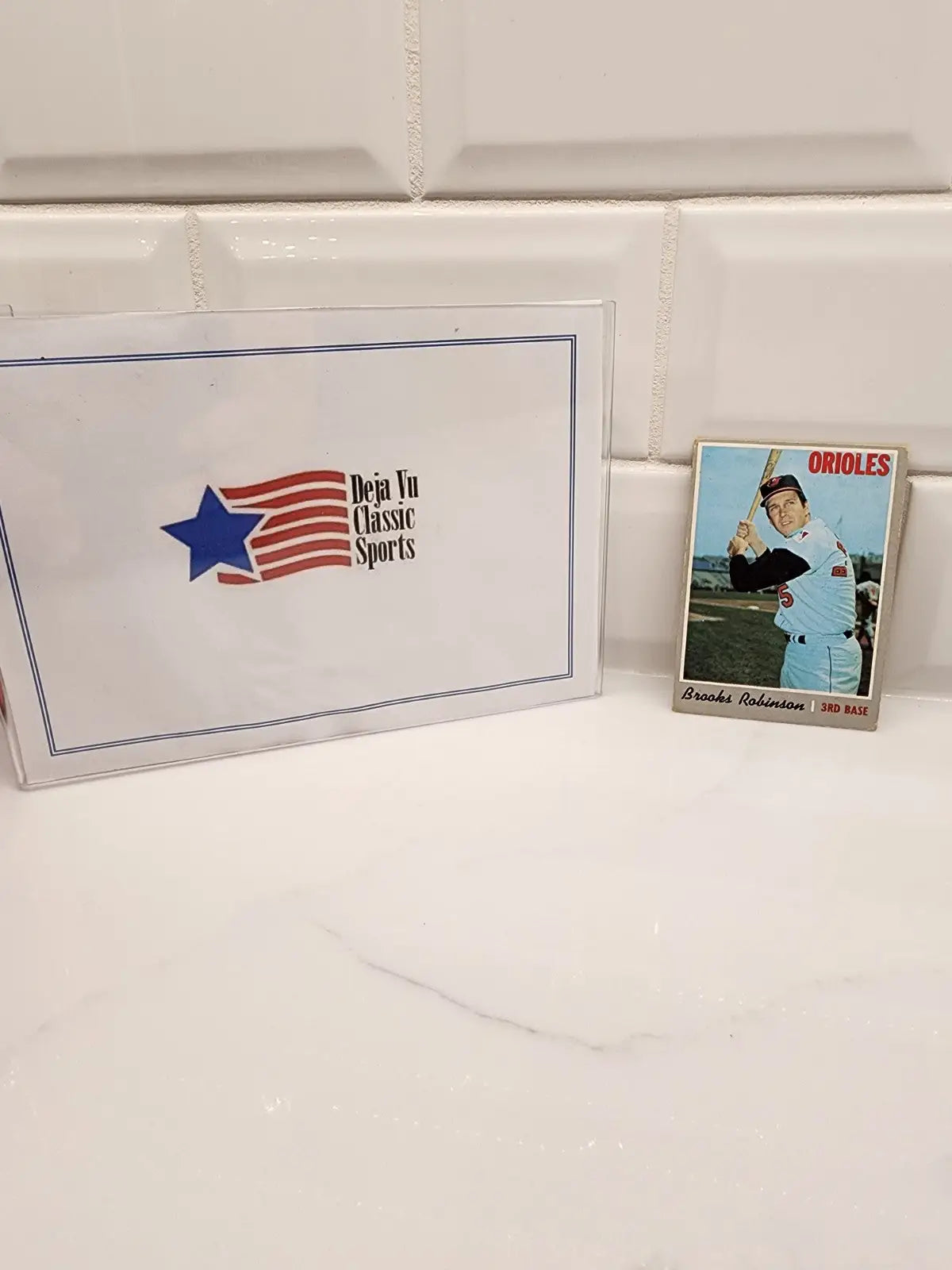 Brooks Robinson trading card and box from 1970 Topps #230 showcasing Brooks Robinson baseball