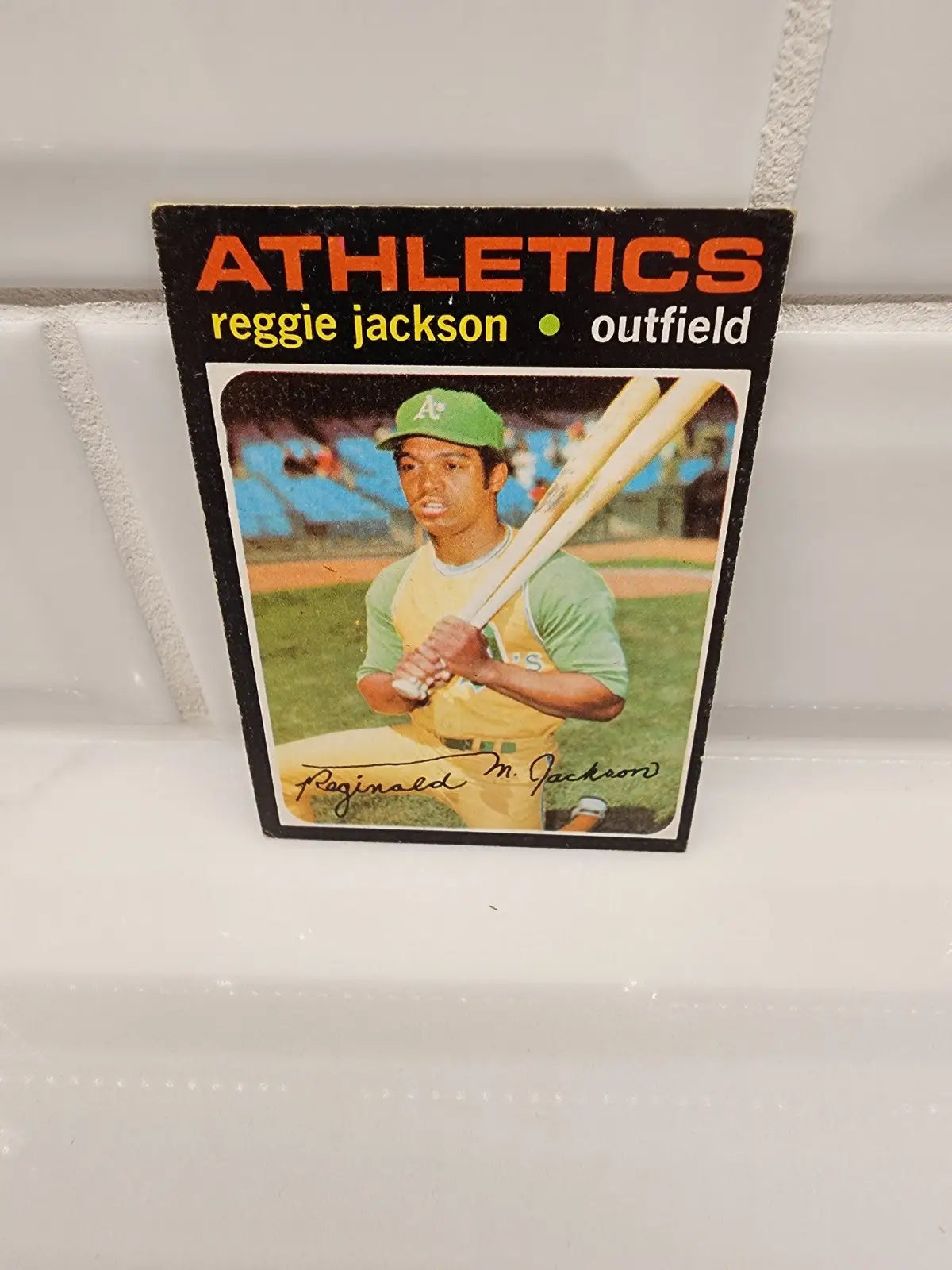 Reggie Jackson baseball trading card from 1971 Topps featuring Oakland Athletics player
