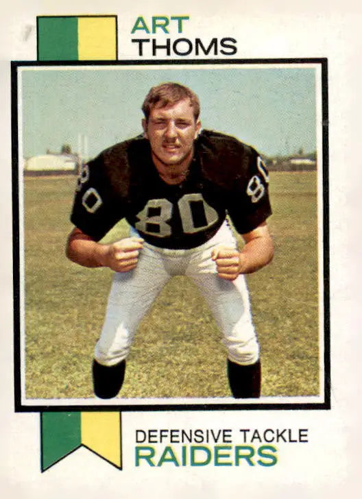 Art Thoms football card from 1973 Topps #502 featuring Art Thoms in his football uniform
