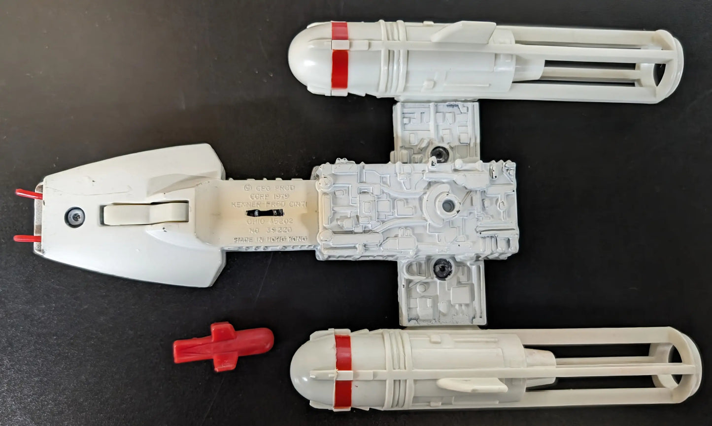 Plastic toy spaceship model of Kenner Star Wars Die-Cast Y-Wing Fighter with detachable parts
