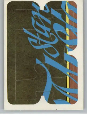 Partially assembled Musial puzzle in original gloss featuring blue script and brown yellow stripes
