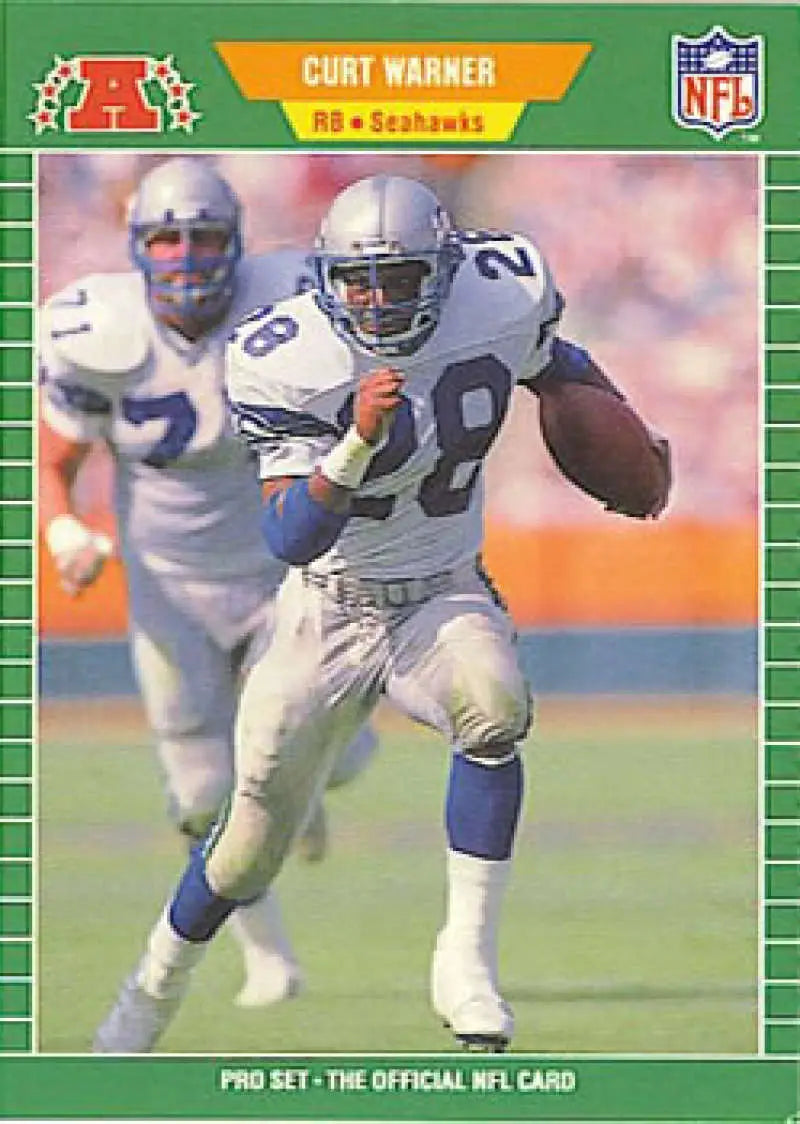 Curt Warner running with the ball on a Seattle Seahawks football trading card