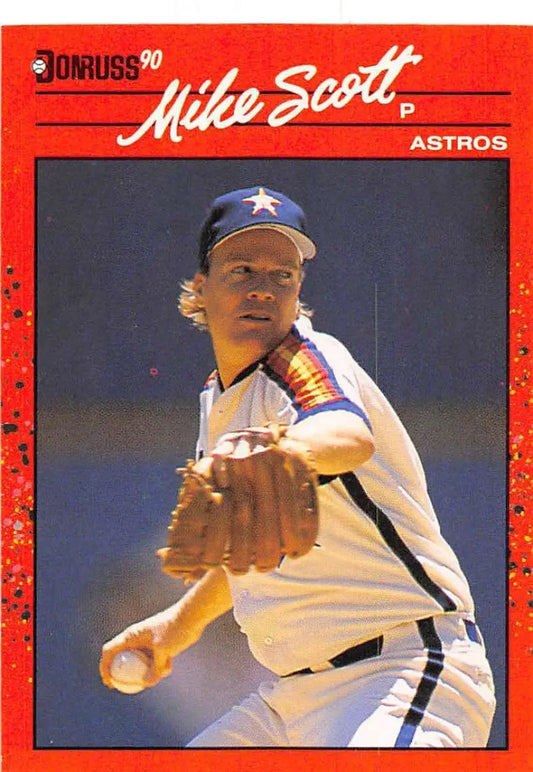Red-bordered 1990 Donruss Mike Scott Houston Astros baseball card in mid-delivery