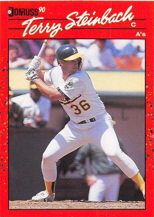 1990 Donruss #268 Terry Steinbach baseball card featuring Oakland Athletics player at bat