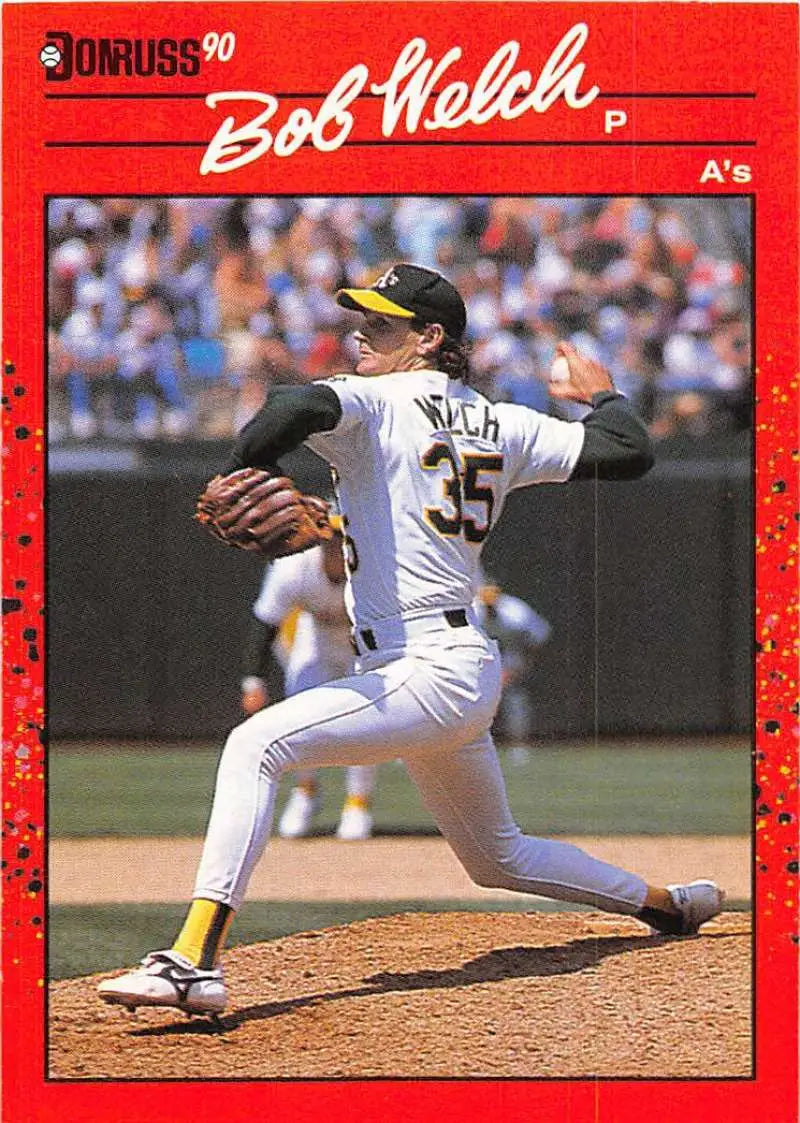 1990 Donruss #332 Bob Welch baseball card of Oakland Athletics pitcher mid-delivery