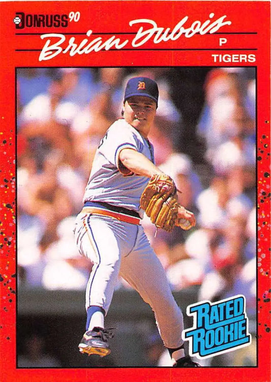 Red 1990 Donruss Brian DuBois Rookie Detroit Tigers Baseball Card in mid-delivery pose
