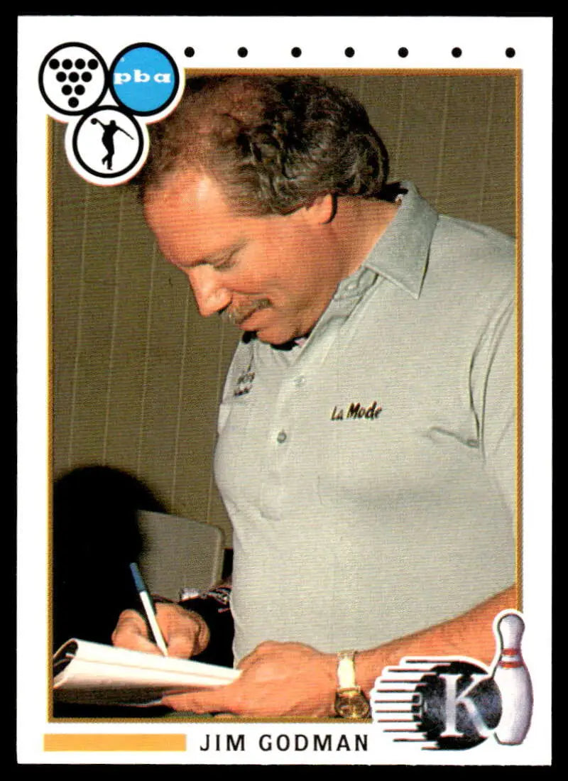 Person in gray polo signing Jim Godman PBA Bowling Card for collectors