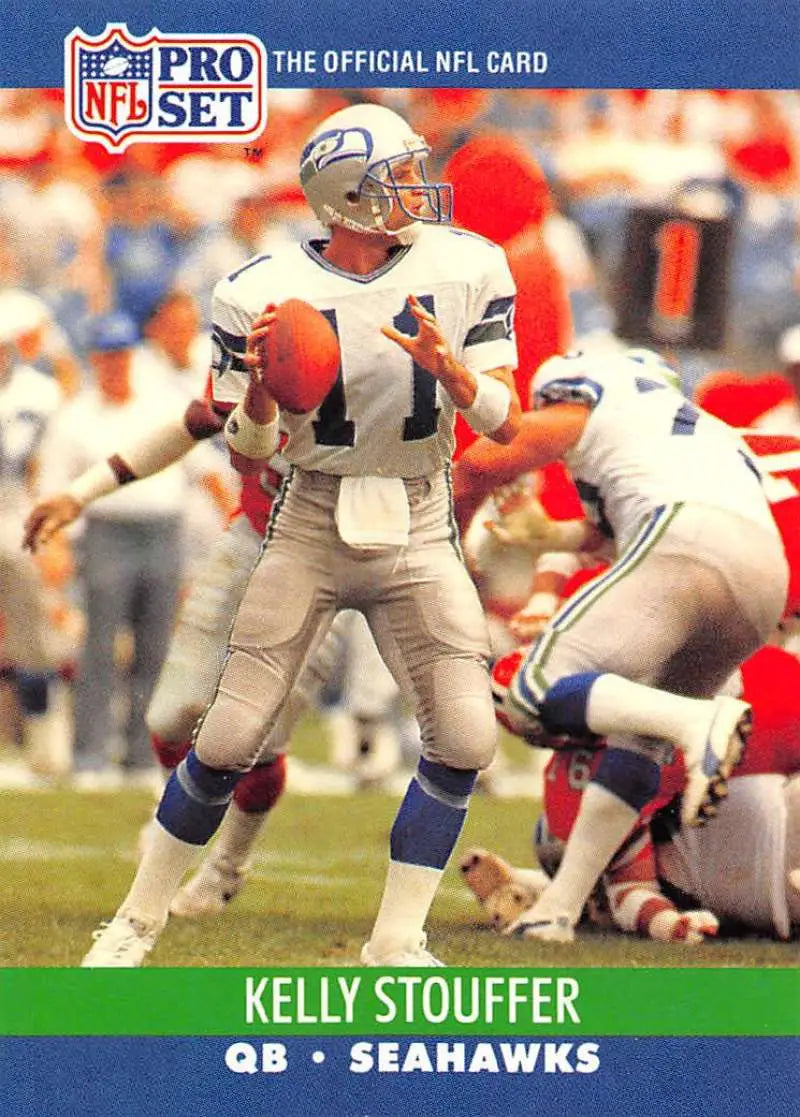 NFL Pro Set trading card of Kelly Stouffer in Seahawks uniform dropping back to pass