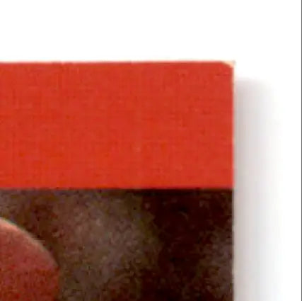 Red and black Pro Set Football book cover with worn corner featuring Football Steve Young