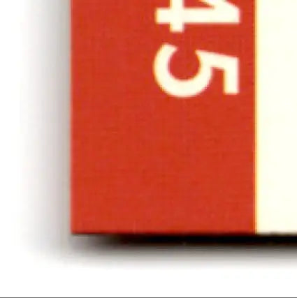 Red rectangular pro set football with white stripe featuring football Steve Young’s card