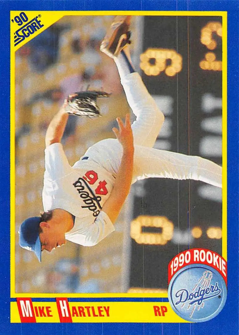 Baseball card of Mike Hartley, Dodgers pitcher in delivery motion wearing white uniform