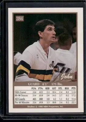 Vintage SkyBox John Stockton basketball trading card in white, gold, and black jersey