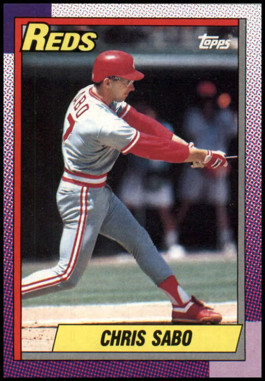 1990 Topps Chris Sabo Baseball Card featuring Cincinnati Reds player in mid-swing