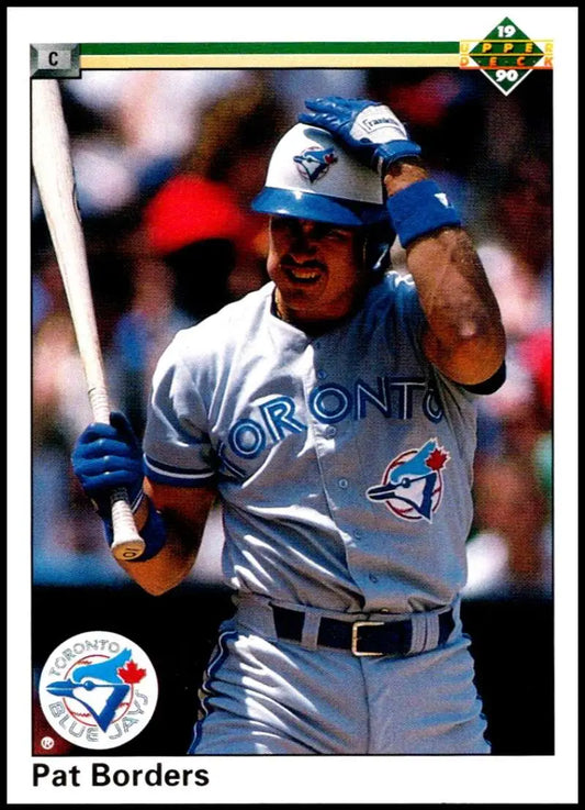 Pat Borders at bat in gray uniform, featured on 1990 Upper Deck baseball card
