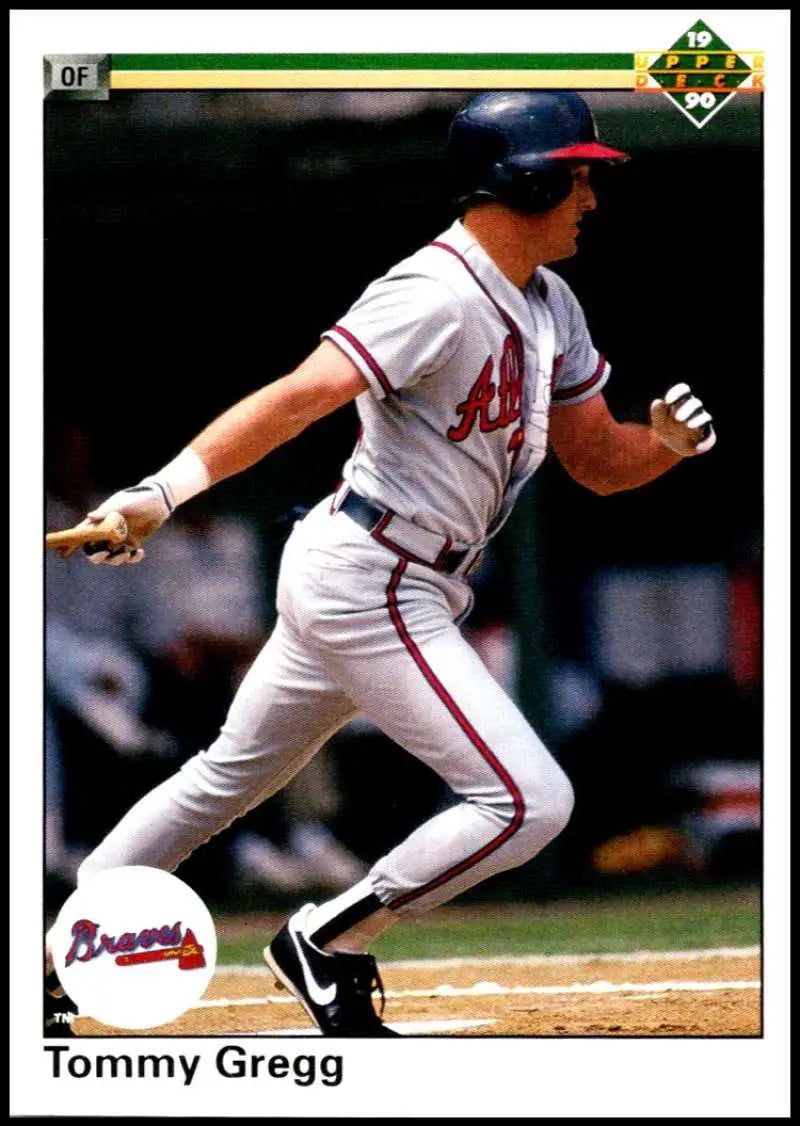 Baseball player Tommy Gregg mid-swing in Atlanta Braves uniform for baseball card