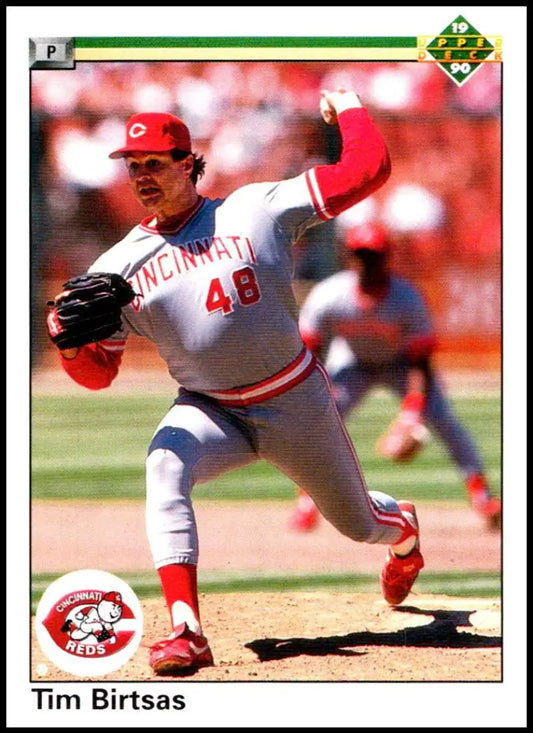 Tim Birtsas pitching for the Cincinnati Reds in white uniform with red trim