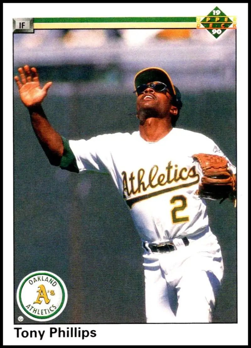 Tony Phillips catching a baseball in white uniform on 1990 Upper Deck Oakland Athletics card
