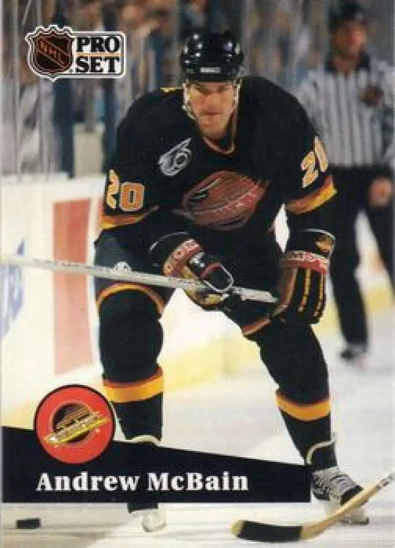NHL Pro Set trading card of Andrew McBain in Vancouver Canucks black and yellow uniform
