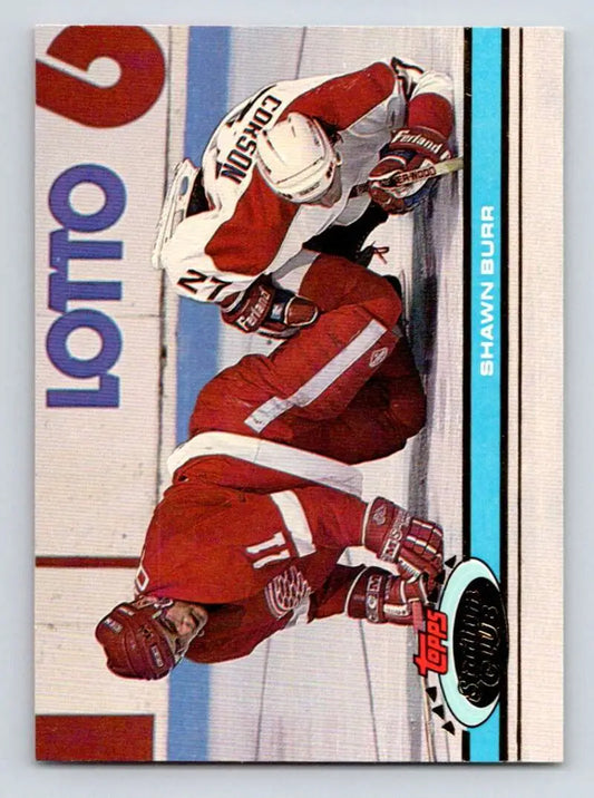 Hockey player in red and white uniform skating for Detroit Red Wings Shawn Burr card