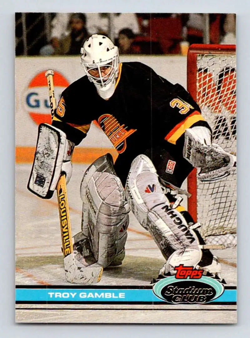 Hockey goalie Troy Gamble in Vancouver Canucks jersey by net on Topps Stadium Club card