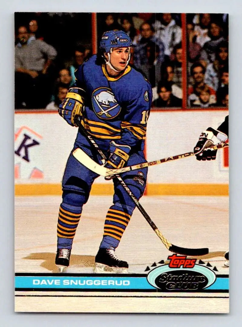 Hockey player in blue and yellow Buffalo Sabres uniform, featuring Dave Snuggerud