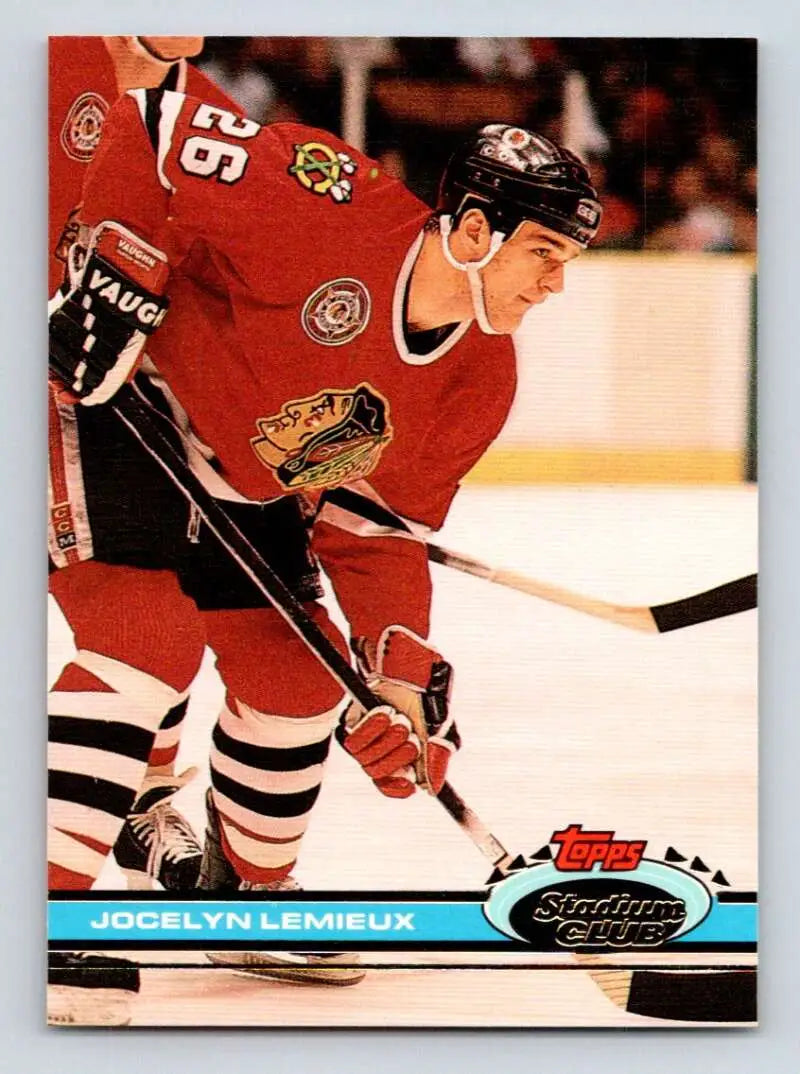 Hockey player in red Chicago Blackhawks jersey, featured on Jocelyn Lemieux Topps Stadium Club card