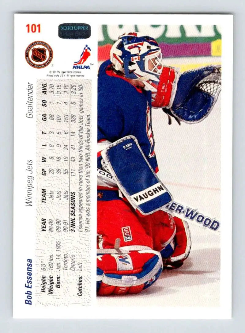 Hockey goalie Bob Essensa in red and blue gear making a save for Winnipeg Jets Hockey Card