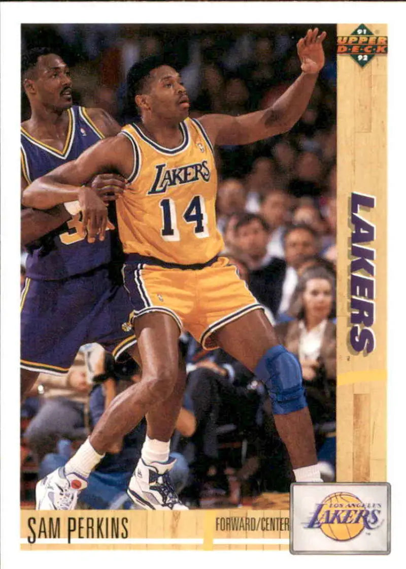 Basketball player in yellow Lakers jersey #14 reaching up in game action, Sam Perkins card