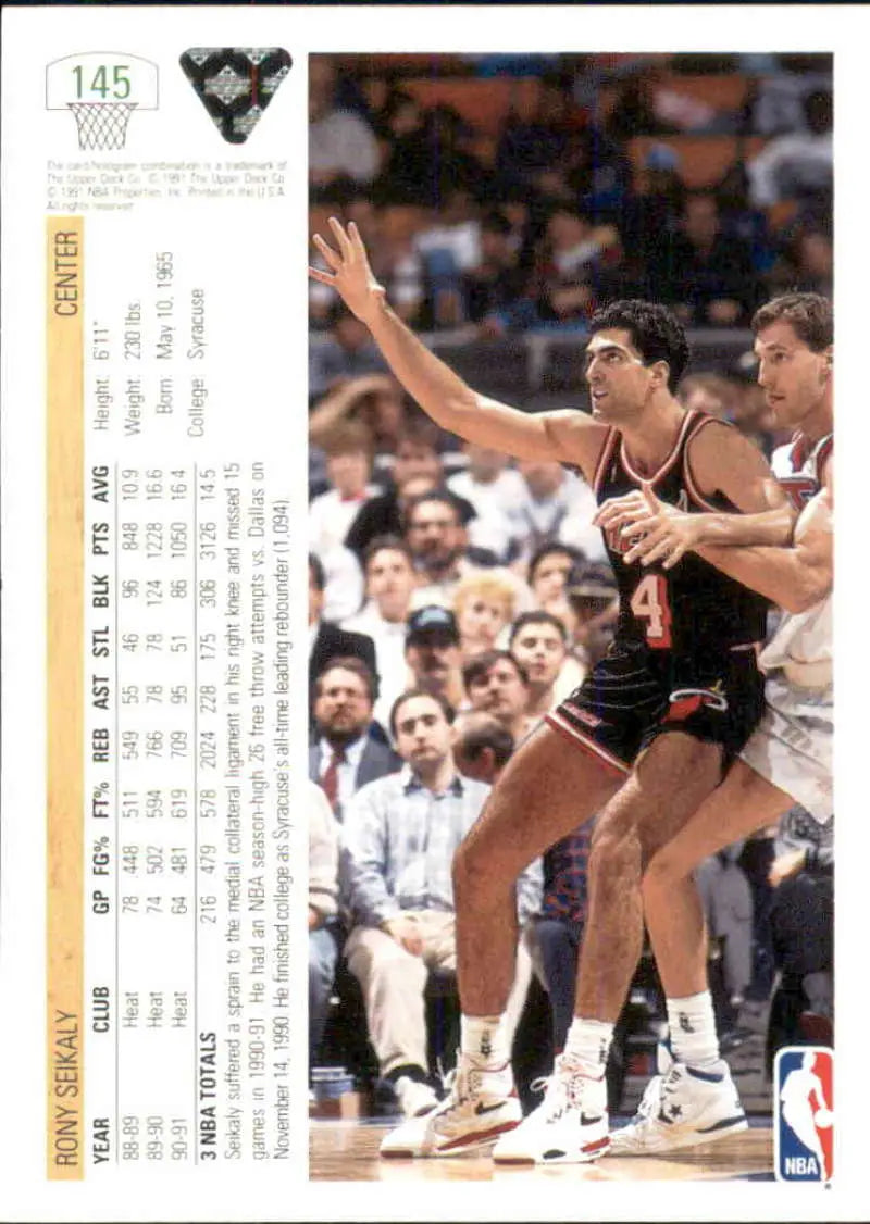 Basketball card of Rony Seikaly in dark Miami Heat uniform number 44 posting up