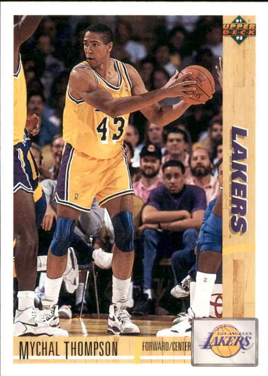 Basketball player in yellow Lakers jersey holding ball, representing Mychal Thompson