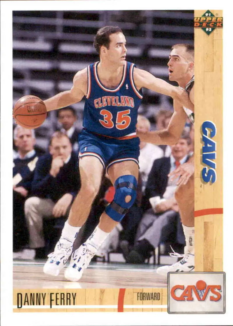 Basketball player dribbling in a blue Cleveland Cavaliers #35 jersey, Danny Ferry