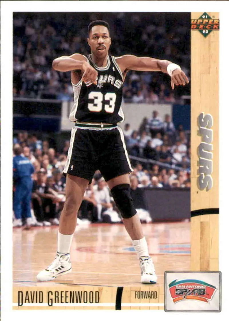 San Antonio Spurs player wearing jersey number 33 in a black and white uniform