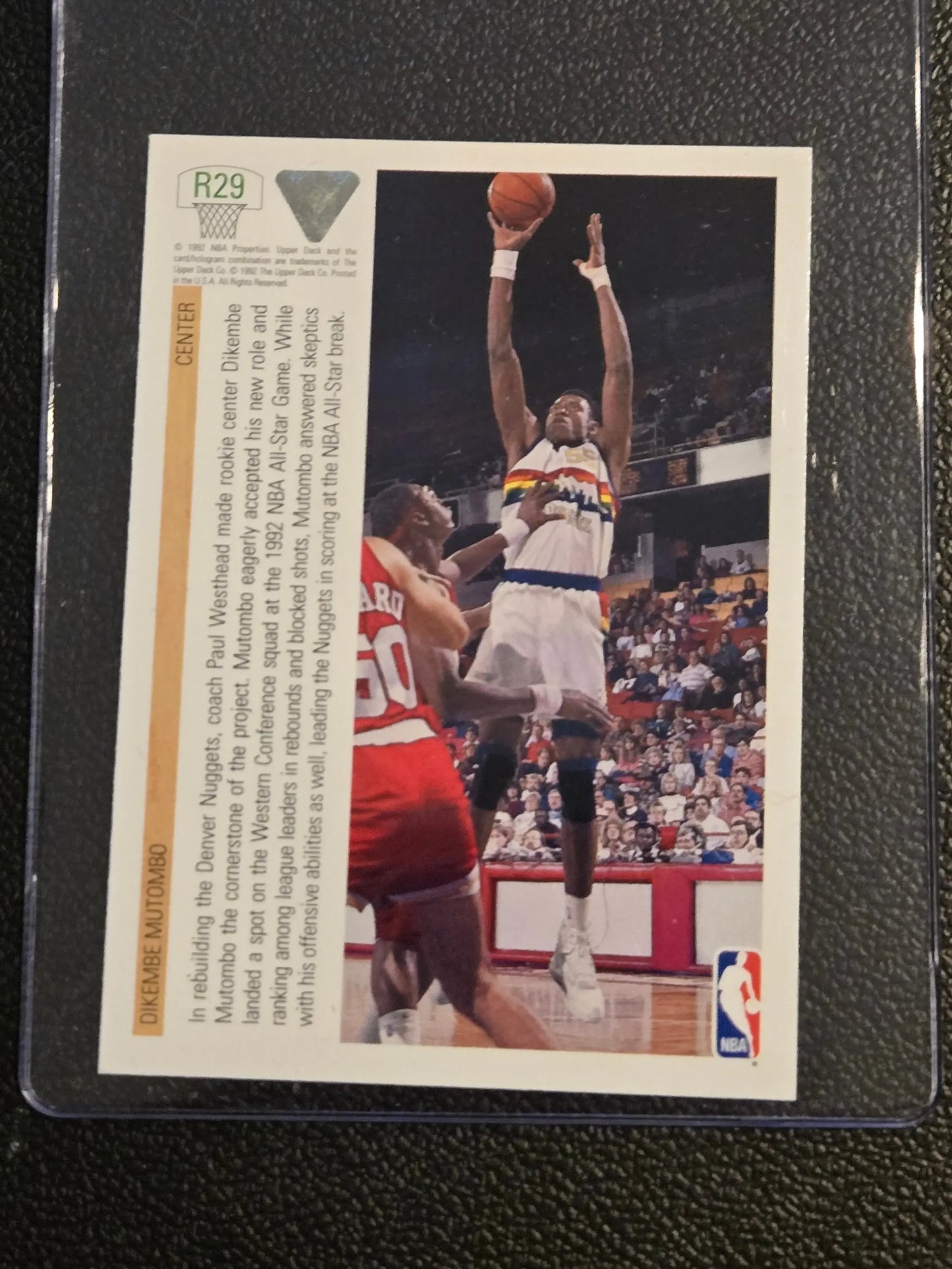 Basketball trading card featuring Dikembe Mutombo R29 Dikembe Mutombo Rookie Standouts