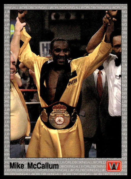 Boxing champion Mike McCallum in yellow celebrating with championship belt on boxing card
