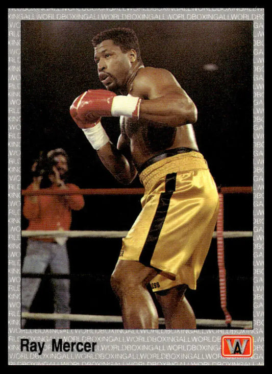 Ray Mercer in yellow shorts throwing a punch, featured on a boxing card
