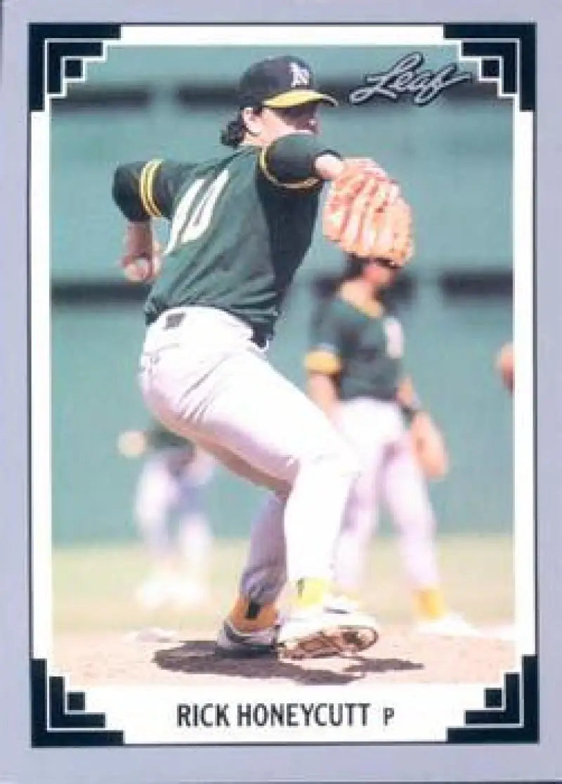 Rick Honeycutt mid-delivery in green jersey on 1991 Oakland Athletics baseball card